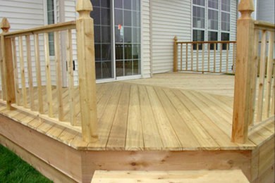 Deck - mid-sized backyard deck idea in Other with no cover