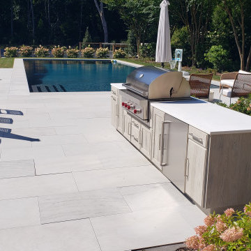 A GRAND SLAM OUTDOOR KITCHEN BY THE TENNIS COURT IN EAST HAMPTON, NY