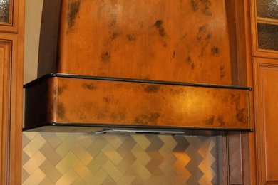 Example of a mid-sized minimalist kitchen design in Oklahoma City with metallic backsplash and metal backsplash