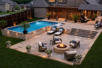 Pool - huge traditional concrete paver and l-shaped privacy pool idea in Dallas