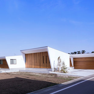 福岡のモダンスタイルのおしゃれな家の外観 (マルチカラーの外壁、片流れ屋根) の写真