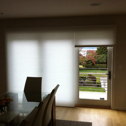 Duette honeycomb shades over large Nano Doors in dining area - Cellular Shades