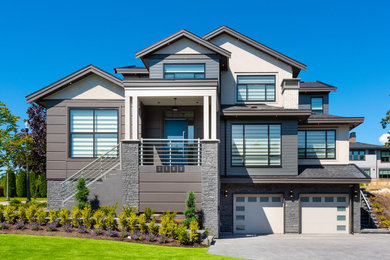 Example of a transitional home design design in Vancouver