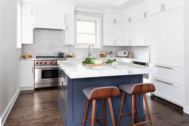 Inspiration for a mid-sized transitional dark wood floor kitchen remodel in Chicago with shaker cabinets, white cabinets, marble countertops, gray backsplash, marble backsplash, stainless steel appliances, an island and gray countertops