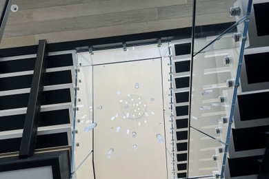 Inspiration for a modern glass railing staircase remodel in DC Metro