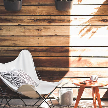 Outdoor Patio with Butterfly Chair and Sidetable