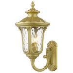 Livex Lighting - Oxford 3-Light Soft Gold Outdoor Large Wall Lantern - From the Oxford outdoor lantern collection, this traditional cast aluminum upward facing three-light large wall lantern design will add curb appeal to any home. It features a handsome, antique-style wall plate and decorative arm. Clear water glass casts an appealing light and lends to its vintage charm. The wall plate, arm and other details are all in a soft gold finish. With superb craftsmanship and affordable price, this fixture is sure to tastefully indulge your senses.