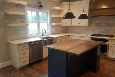 Eat-in kitchen - mid-sized farmhouse l-shaped medium tone wood floor eat-in kitchen idea in Raleigh with a farmhouse sink, shaker cabinets, white cabinets, wood countertops, white backsplash, wood backsplash, stainless steel appliances, an island and white countertops