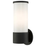 Livex Lighting - Textured Black Contemporary, Urban, Minimalistic, Clean Outdoor Wall Lantern - Add a dash of character and radiance to the exterior of your home with this wall lantern. This single-light small fixture from the Landsdale Collection features a satin opal white glass cylinder closed top shade, set off with a textured black finish. The clean lines of the back plate complement the cylindrical glass shade adorned with detailed trim at the end creating a minimal, sleek look that works well in most outdoor or indoor settings. This fixture adds charm and contemporary aesthetics to your home.
