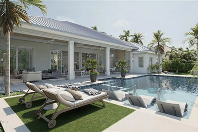 Example of a mid-sized backyard stone and rectangular hot tub design in Miami