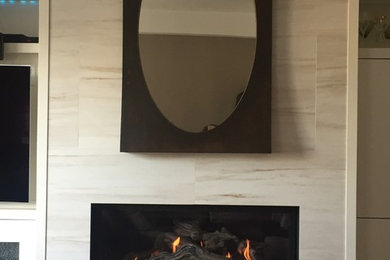 Living room - mid-sized contemporary open concept dark wood floor and brown floor living room idea in Toronto with beige walls, a ribbon fireplace and a wall-mounted tv