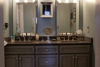 Example of a mid-sized classic master white tile and porcelain tile alcove shower design in Other with flat-panel cabinets, gray cabinets, quartz countertops and a hinged shower door