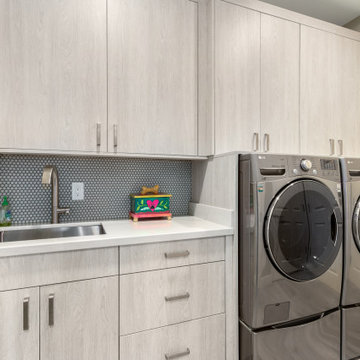 Scottsdale, AZ Custom Laundry Room with Built-In Storage and Utility Sink