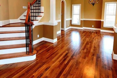 Mid-sized elegant wooden curved wood railing staircase photo in San Diego with painted risers