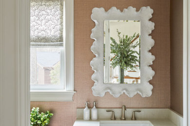 Example of a mid-sized transitional powder room design in New York