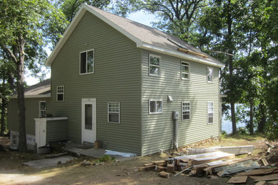 Example of a beach style home design design in Other