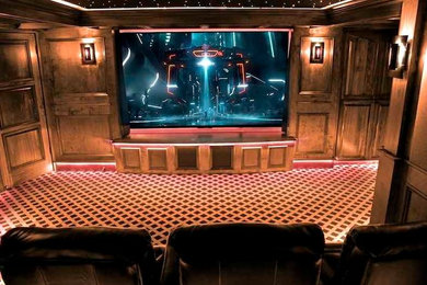 Inspiration for a mid-sized timeless enclosed carpeted home theater remodel in Grand Rapids