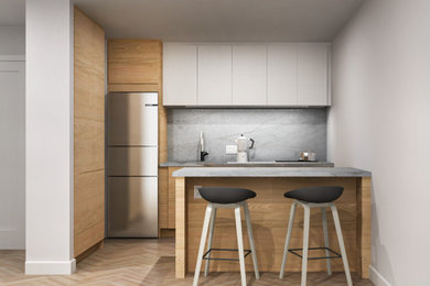 Example of a mid-sized danish l-shaped light wood floor and brown floor eat-in kitchen design in Miami with an undermount sink, flat-panel cabinets, light wood cabinets, quartzite countertops, gray backsplash, marble backsplash, stainless steel appliances, an island and gray countertops