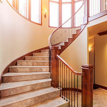 Sweeping Circular Staircase with Wood and Iron Stair Parts