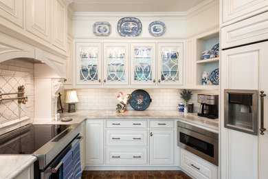 Inspiration for a small traditional u-shaped separate kitchen in Tampa with a farmhouse sink, beaded inset cabinets, white cabinets, granite benchtops, white splashback, ceramic splashback, stainless steel appliances, brick floors, red floor and white benchtop.