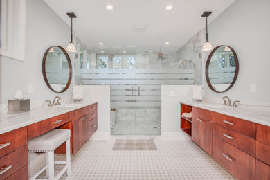 This is an example of a contemporary bathroom in Nashville with flat-panel cabinets, brown cabinets and granite benchtops.