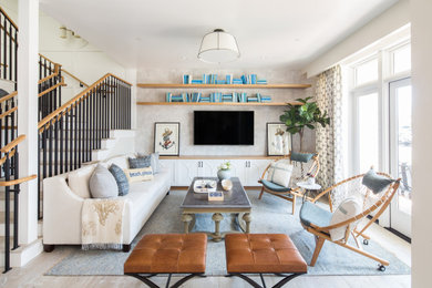 Living room - coastal light wood floor and wallpaper living room idea in Orange County