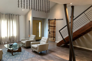 Example of a mid-sized minimalist formal and open concept light wood floor and beige floor living room design in Orange County with gray walls, no fireplace and no tv