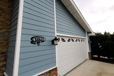 Inspiration for a mid-sized blue two-story concrete fiberboard house exterior remodel in Orange County