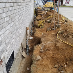 Foundation repair with helical piers spaced as needed to transfer weight to pier - Products