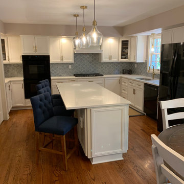 cabinet reface--white with quartz and tile splash, also removal of bulkhead
