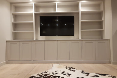 Media, shelving and cupboards in family recreation room