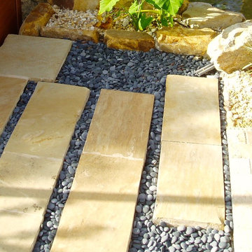 Stepping stones beach pebbles and stone edging