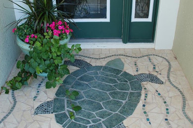 Inspiration for a mid-sized coastal multicolored floor entryway remodel in Orlando with a green front door