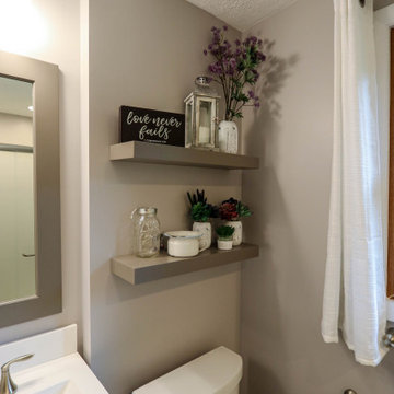 Master Bathroom with Frappe Gray Vanity, Closet Storage and Shower Enclosure