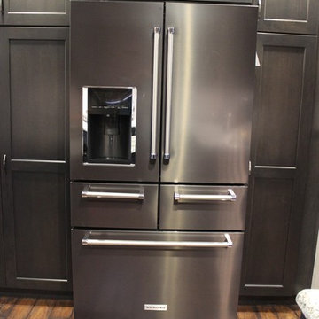 DuraSupreme Peppercorn Kitchen With Cambria Tops and Black Stainless Appliances