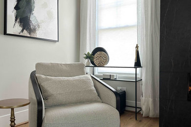 Example of a large trendy enclosed medium tone wood floor and brown floor living room design with white walls, a ribbon fireplace and a wall-mounted tv