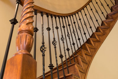 Inspiration for a mediterranean carpeted spiral staircase remodel in Orange County with wooden risers