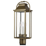 Visual Comfort Studio Collection - Wellsworth Post Lantern, Painted Distressed Brass - The Feiss Wellsworth three light outdoor post top in painted distressed brass creates a warm and inviting welcome presentation for your home's exterior. A subtle interplay of traditional design elements and nautical influences creates the charming visual approach to the Wellsworth outdoor collection by Feiss. Available in three finishes and two different aesthetics. Antique Bronze finish paired with Clear Seeded glass creates a more traditional look to these outdoor light fixtures; while Burnished Brass and Painted Brushed Steel finish coupled with Clear glass reflects a more contemporary approach. The Wellsworth collection includes a 3-light outdoor pendant, a 3-light outdoor post lantern, and 3-light small and medium outdoor lanterns, as well as a 4-light large outdoor lantern. Cast aluminum construction ensures durability. Wet Rated.