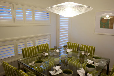 Photo of a modern dining room in Brisbane with white walls.