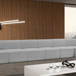 Meridian Furniture - Ollie Black Boucle Fabric L-Shaped Modular Sectional, Grey, 7-Piece: 5 Armless Chair, 2 Corner Chair - The Ollie Boucle Fabric Sectional is a truly stunning piece that boasts an elegant and attention-grabbing design. It is upholstered in a rich grey boucle fabric that feels soft and smooth to the touch, making it the perfect addition to any space that requires a touch of sophistication and style. The sectional's modular design ensures that it can easily fit into any room layout, while its plush cushioning provides optimum comfort for you and your guests. Whether you're entertaining guests or simply relaxing after a long day, the Ollie sectional is the perfect piece to help you unwind in style.