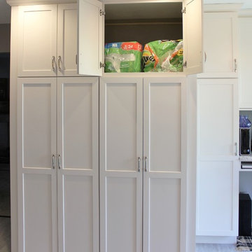 Alpha, IL White and Gray Kitchen with Hidden Laundry and Raised Dishwasher