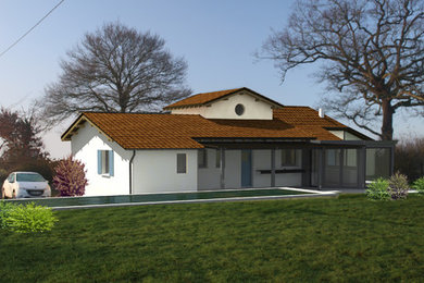 Exemple d'une maison tendance de taille moyenne.