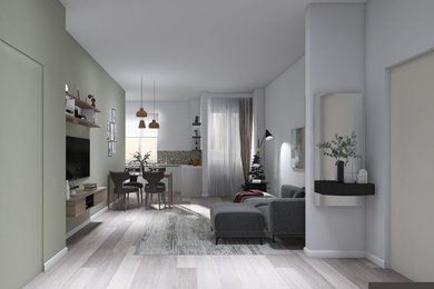 Imagen de salón abierto contemporáneo de tamaño medio con paredes verdes, suelo de baldosas de porcelana, televisor colgado en la pared, suelo gris y alfombra