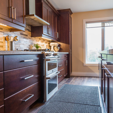 Falsetta - Brown Cabinets with Mosaic Tile Backsplash