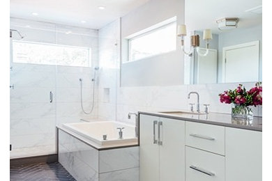 Example of a minimalist master white tile and porcelain tile porcelain tile and gray floor bathroom design in Houston with an undermount sink, quartz countertops and a hinged shower door