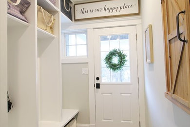 Mid-sized transitional foyer in Boston with grey walls, porcelain floors, a single front door, a white front door and grey floor.