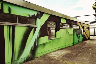 Haus mit Faserzement-Fassade und grüner Fassadenfarbe in Hannover