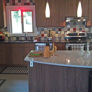 Open kitchen design that resulted from removing along wall separating the kitche