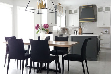 Example of a large trendy eat-in kitchen design in Toronto with an undermount sink, raised-panel cabinets, white cabinets, quartz countertops, white backsplash, stainless steel appliances, an island and white countertops