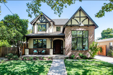 Inspiration for a mid-sized timeless beige two-story mixed siding house exterior remodel in San Francisco with a hip roof and a shingle roof